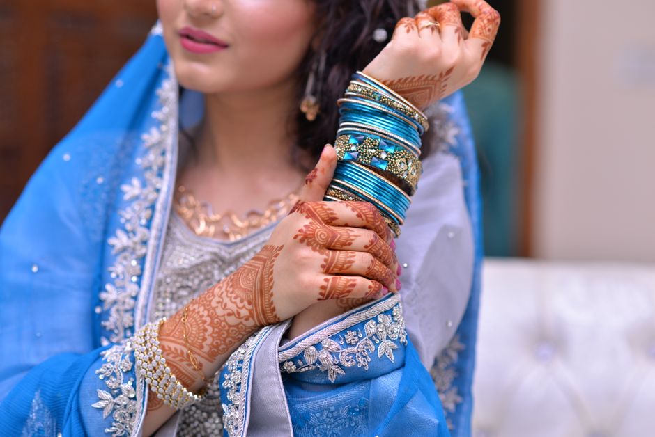 What are the best Pakistani party‑wear fabrics for a Seattle summer wedding with unpredictable rain?
