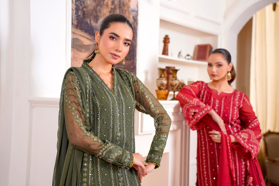 What are the shipping costs for Pakistani designer dresses within the US?